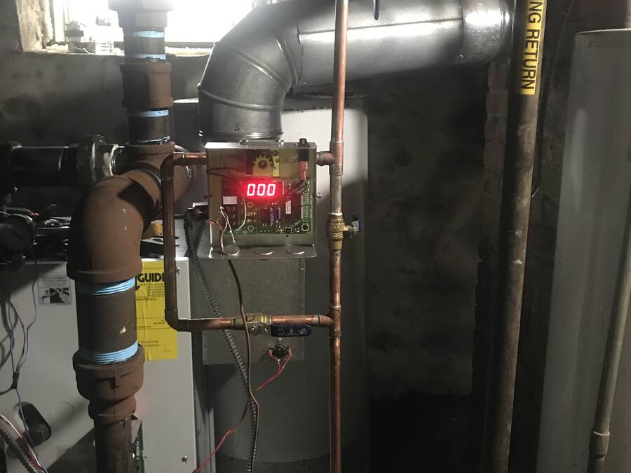 Boiler with new copper piping and controls in a mechanical room