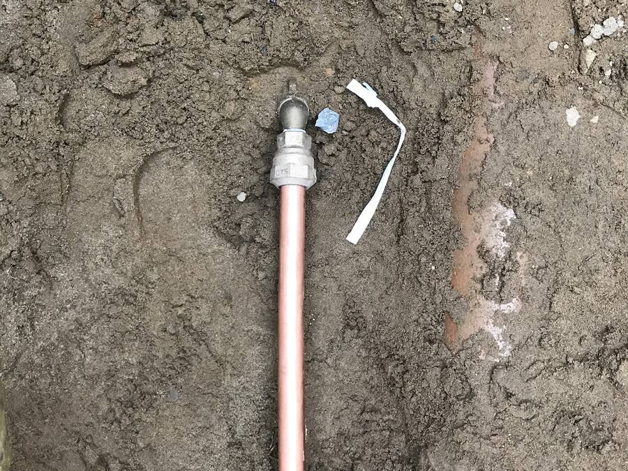 New copper water service line laid in an open trench